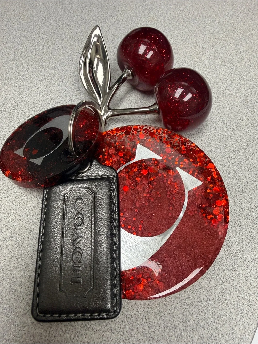 COACH Gunmetal Leather Tag with Red Glitter Cherry Keyring